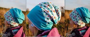 Seitliches Porträt eines Kindes mit türkiser Beanie und buntem Muster-Einsatz