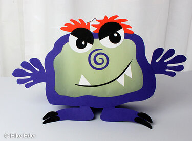 Lila Papiermonster-Laterne mit grüner Front, roten Haaren und ausgestreckten Armen