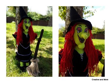 Green crochet witch amigurumi with red yarn hair, black hat and broom standing by a tree