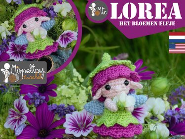 Crocheted amigurumi flower fairy Lorea in pink and green dress holding white flower among purple blossoms