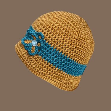 Gehäkelte Damenmütze senfgelb mit türkisem Kontrastband und Zierblume