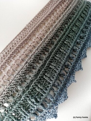 Three narrow crochet strips with ladder openwork and ridged stitches in beige-to-blue gradient yarn