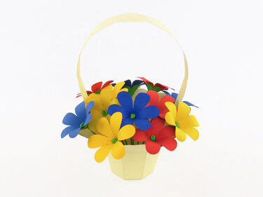 Heller Papierkorb mit Henkel, gefüllt mit roten, gelben und blauen Papierblumen