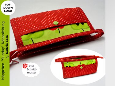 Rotes, weiß gepunktetes Mäppchen mit grünem Apfel-Innenfutter und hellgrünem Druckknopf