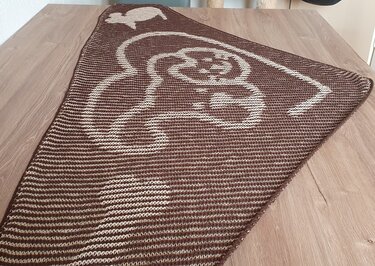 Triangular brown and beige knitted shawl with elephant motif