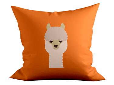 Alpaka-Gesicht als Plottdesign auf orangefarbenem Kissen
