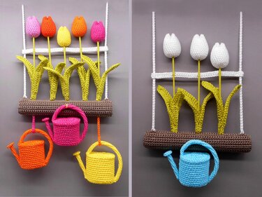 Two crochet wall hangings on a gray background: left with five colorful tulips and three small watering cans; right with three white tulips and a blue watering can.