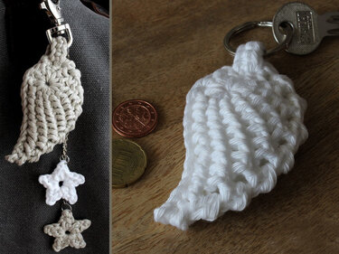 Two crocheted angel wing keychains, one grey with dangling star charms on a clip and one white on a keyring.