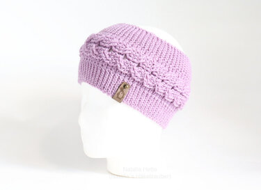 Lavender crocheted cable headband with ribbed band and leather tag on white mannequin head