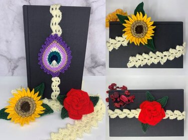 Three crocheted bookmarks on a dark hardcover: cream lace strap with sunflower, red rose, and purple teardrop motif.
