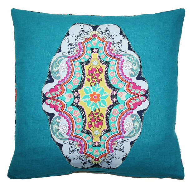 Teal square decorative pillow with central colorful medallion applique