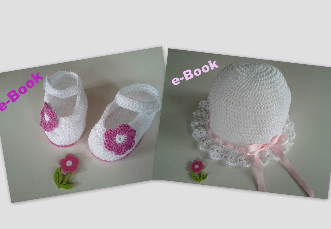 Weiße gehäkelte Babymütze mit Rüsche neben weißen Ballerinas mit rosa Blüte