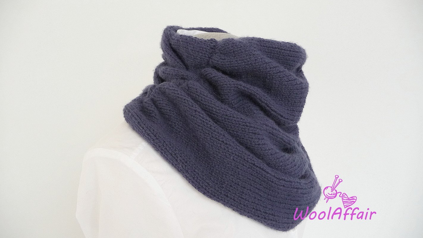 Dark slate knitted infinity cowl on white mannequin