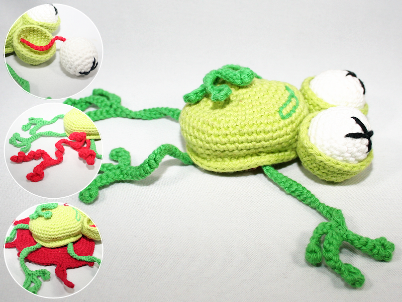 Hellgrünes gehäkeltes Frosch-Amigurumi mit großen weißen Augen und gedrehten Beinen