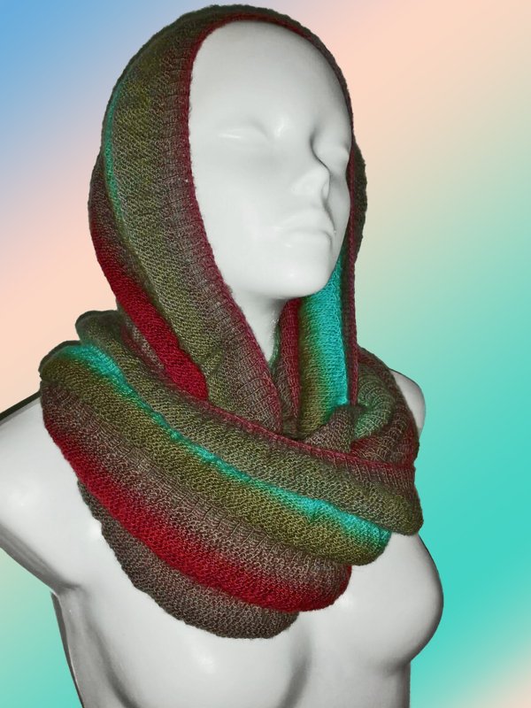 Knitted hooded cowl in green, brown, red and teal stripes on a mannequin