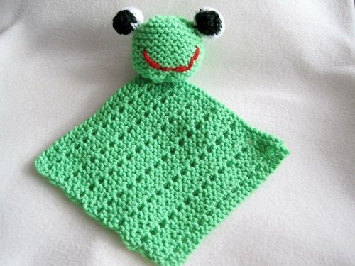 Hellgrünes gestricktes Schmusetuch mit angenähtem Froschkopf und schwarzen Augen