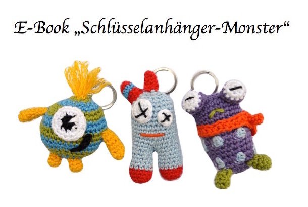 Drei gehäkelte Amigurumi-Monster als Schlüsselanhänger in bunten Garnfarben; oben Schrift 'E-Book "Schlüsselanhänger-Monster"'.