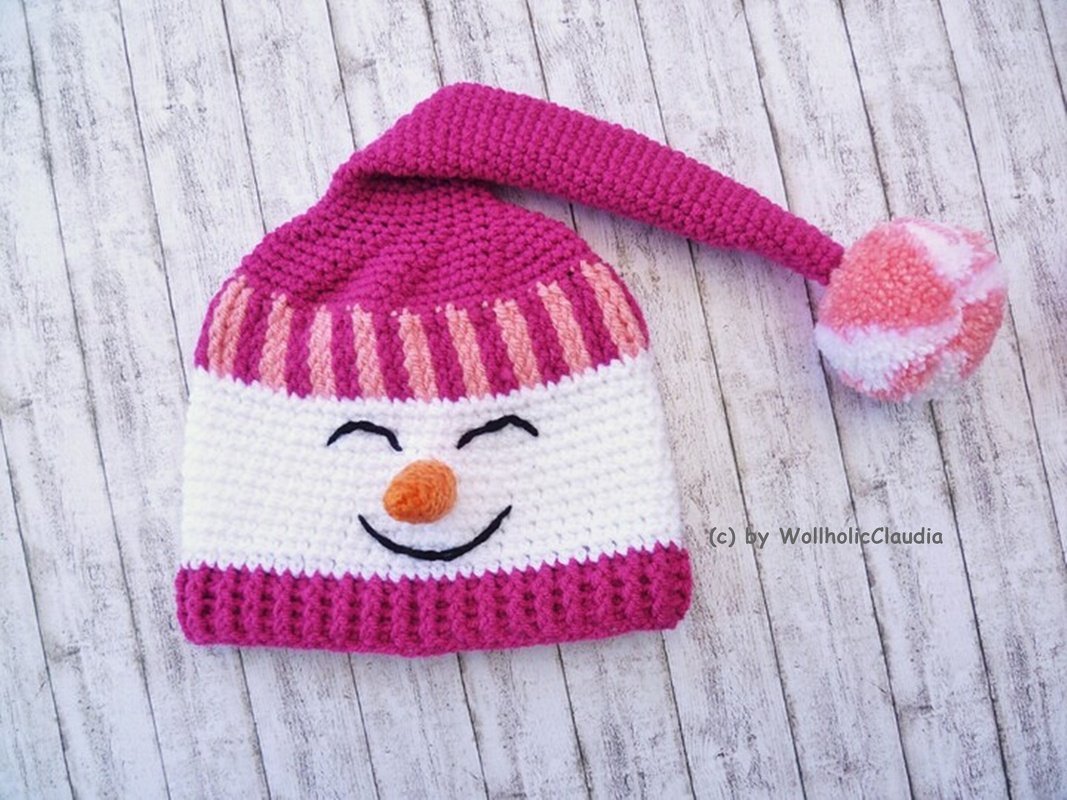 Gehäkelte pink-weiße Schneemannmütze mit langem Zipfel und Pompon