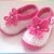 Häkelanleitung: Babyschuhe mit pinker Häkelblume (0 - 12 Monate)