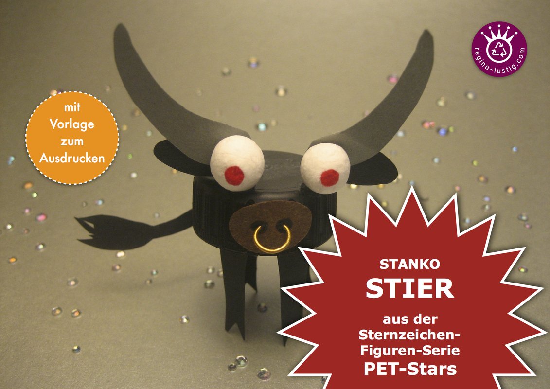Stierfigur aus schwarzem Flaschendeckel mit Papierhörnern, weißen Kugelaugen mit roten Punkten und goldfarbenem Nasenring vor glitzerndem Hintergrund.