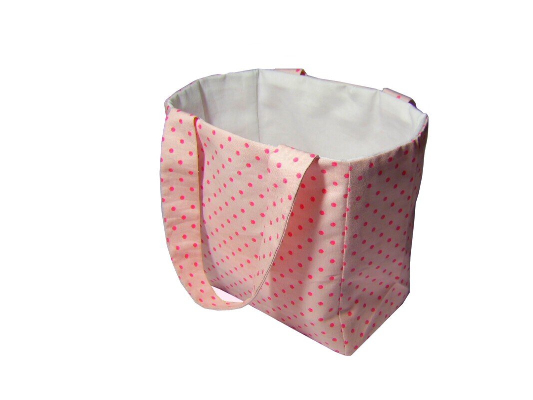 Rosa Utensilo mit pinkfarbenen Punkten, weißem Innenfutter und breiten Henkeln