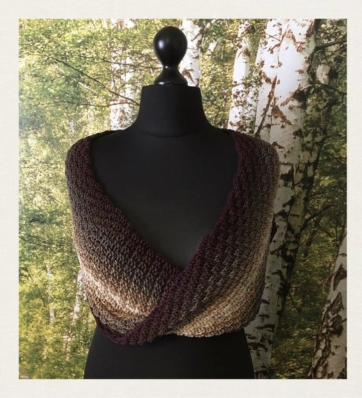 Neutral gradient openwork crochet cowl twisted at front on black mannequin