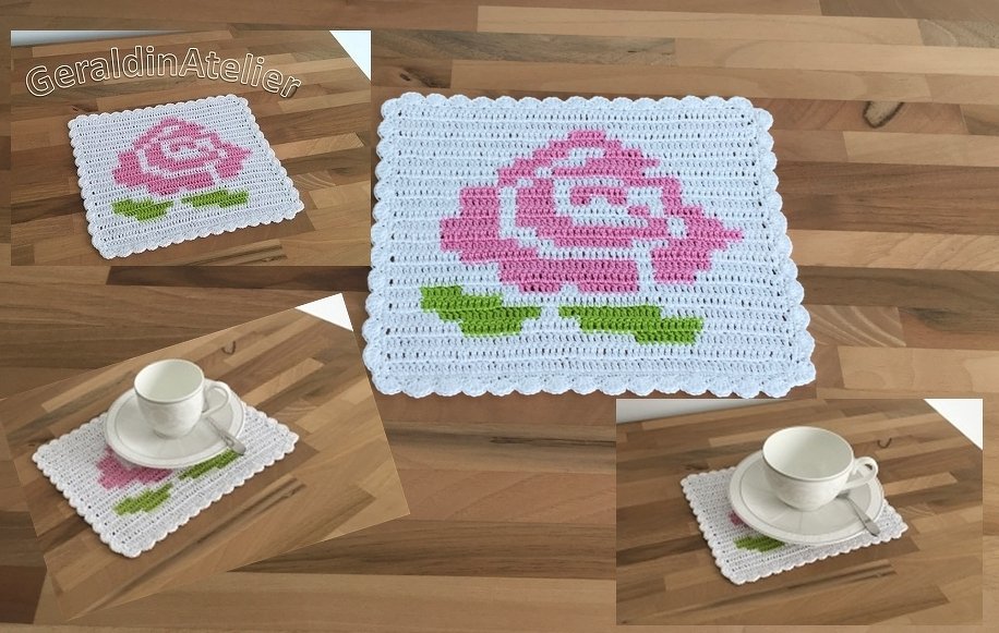 Weißer, quadratischer gehäkelter Untersetzer mit rosa Rose und grünen Blättern auf Holzfläche