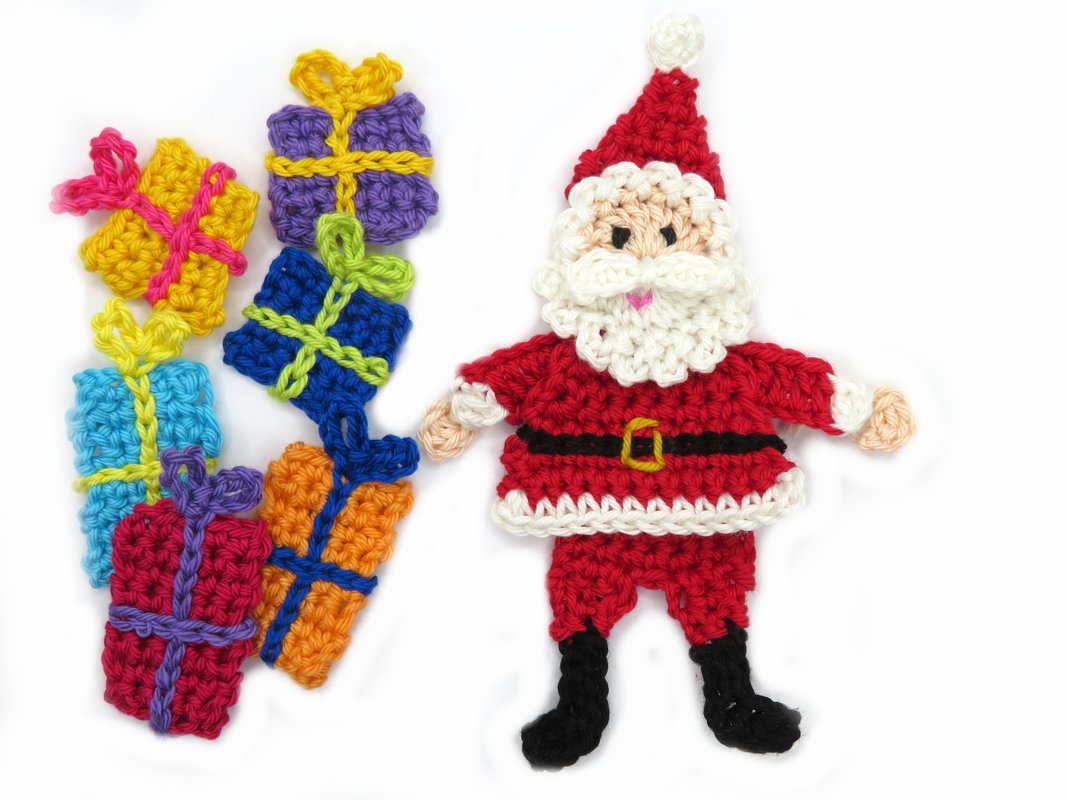 Crocheted Santa Claus and six colorful crocheted gift box appliques on a white background.
