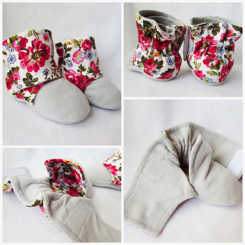 Pair of soft baby booties with light grey soles, white floral uppers, and foldable shafts.