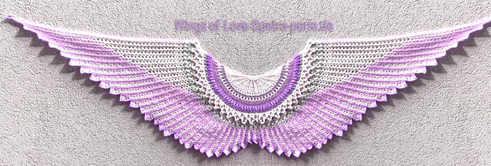 Wing-shaped crochet shawl in white and purple with openwork stitches and scalloped edge.