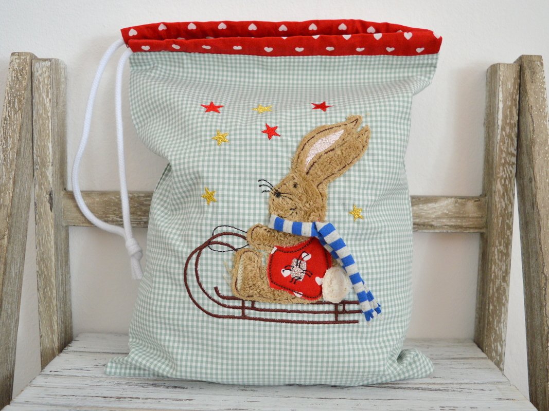 Stickdatei Hase auf Schlitten für den 13x18cm Rahmen