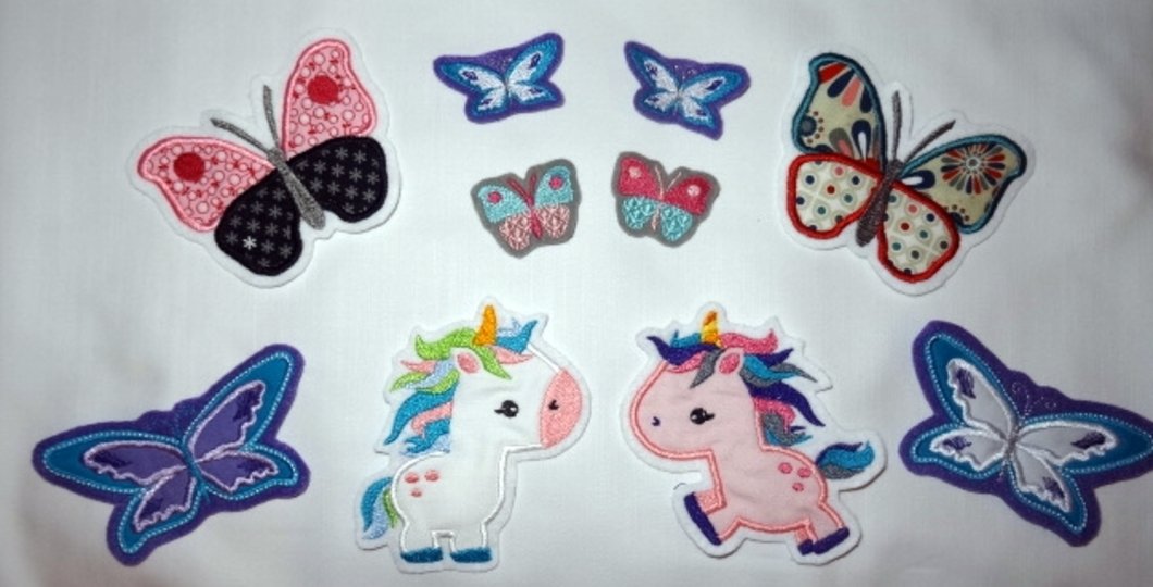 Einhorn und Schmetterling unterm Regenbogen Stickdatei