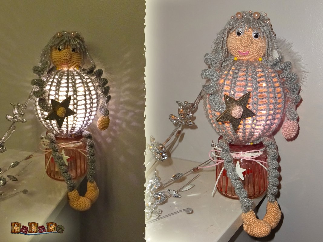 Beleuchteter Häkelengel mit Zöpfen, Perlen und Sternapplikation auf einem Glas