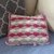 Kleines Sofakissen im Muschelmuster