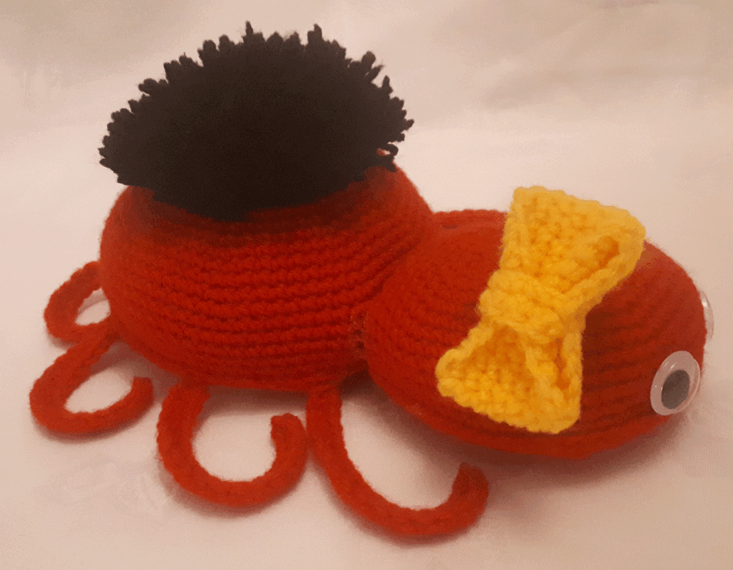 Spinne mit Schleifchen