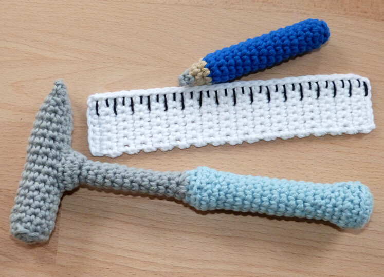 Crochet pattern tools: hammer, screwdriver, wrench, ruler, pencil