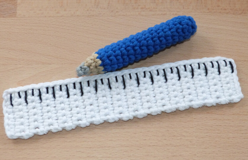 Crochet pattern tools: hammer, screwdriver, wrench, ruler, pencil