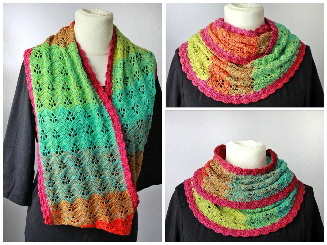 Gehäkelter Schal mit Grün‑Türkis‑Orange Farbverlauf und pinker Borte auf Büste