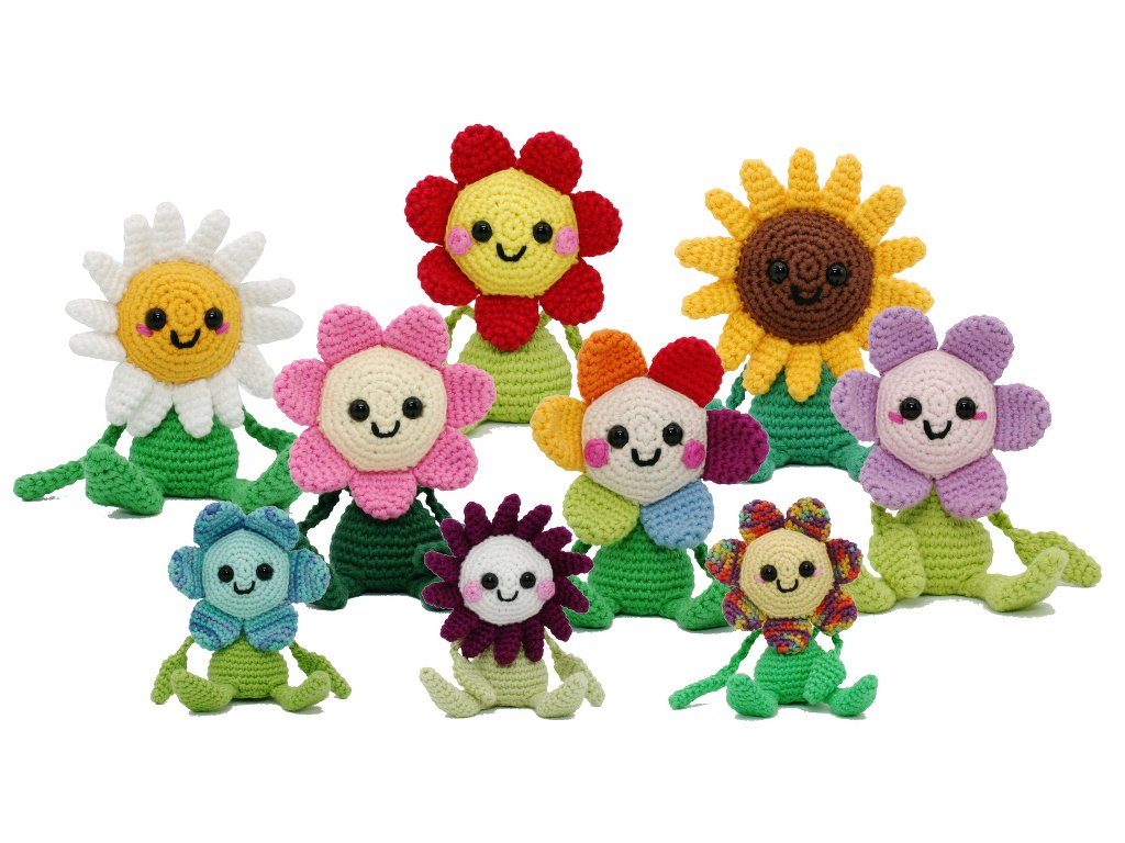 Small crocheted amigurumi flowers showing petal and color variations