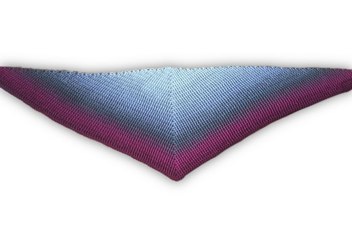 Crocheted triangle shawl with pale blue to magenta gradient