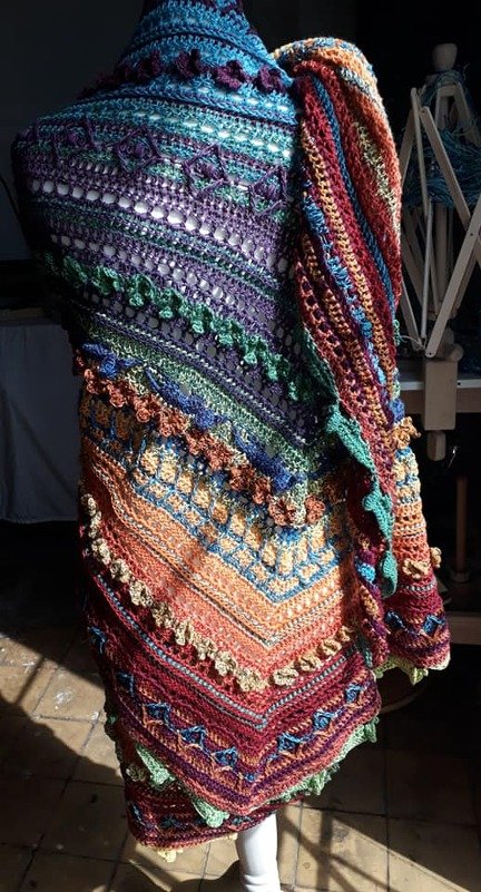 Textured triangle crochet shawl with openwork, shells and bobbles