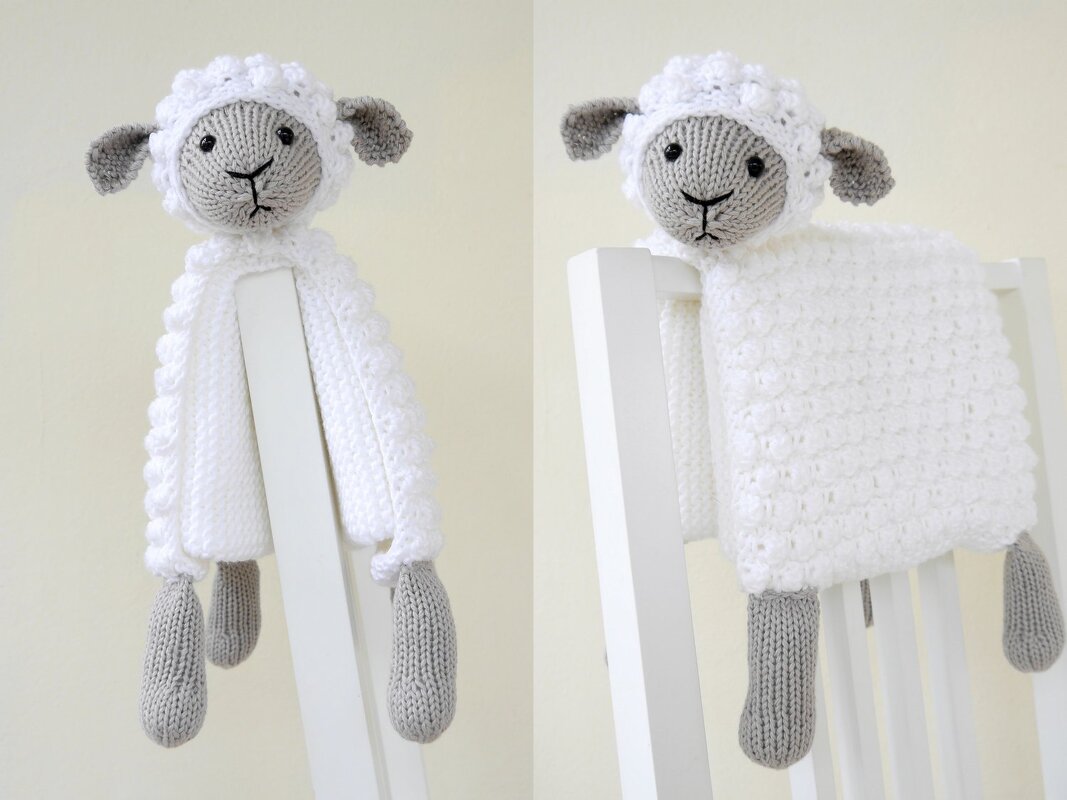 White knitted lamb lovey with grey head and dangling legs draped over a chair