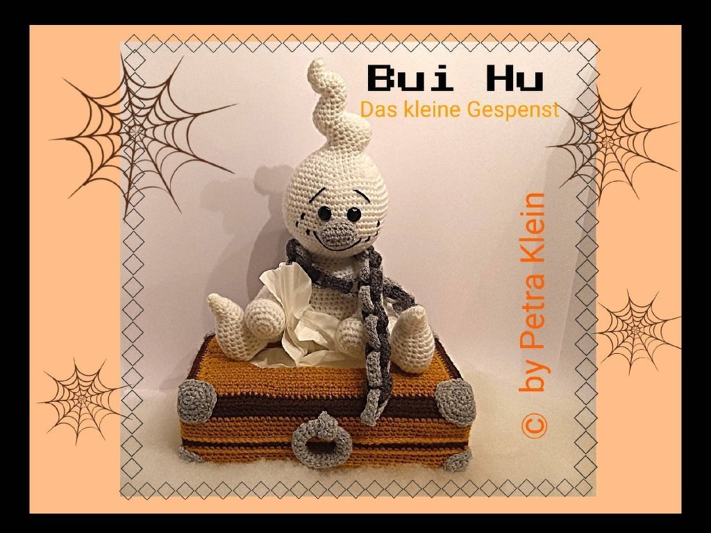 Weißes gehäkeltes Amigurumi-Gespenst auf gehäkelter Taschentuchbox