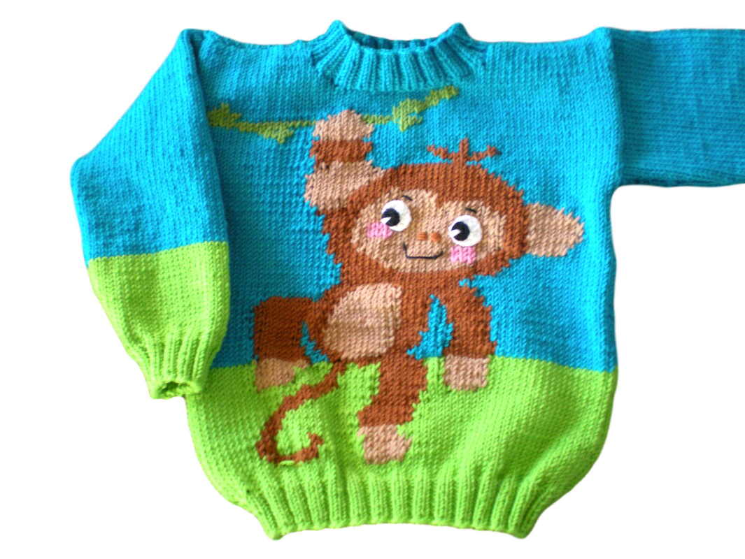 Gestrickter türkis-grüner Kinderpullover mit Affenmotiv und hellgrünem Unterteil