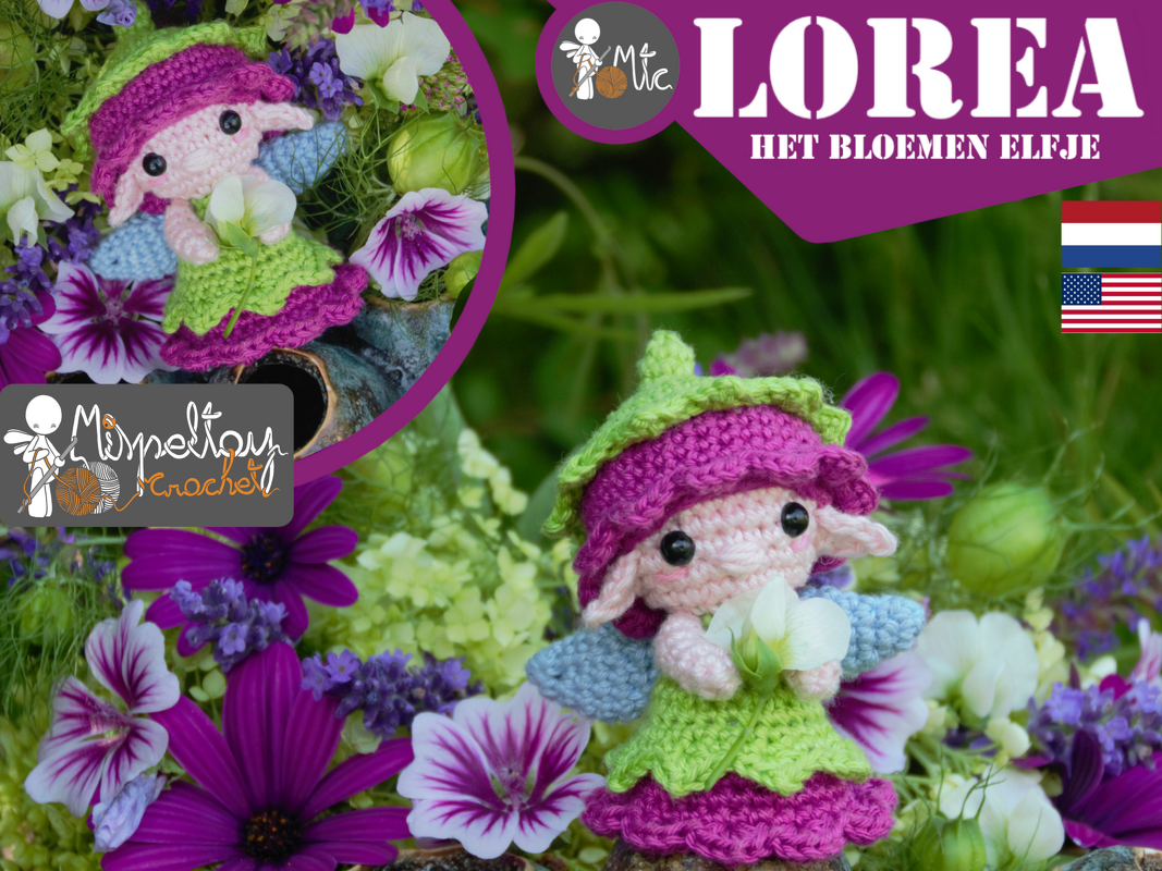 Crocheted amigurumi flower fairy Lorea in pink and green dress holding white flower among purple blossoms