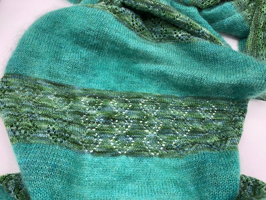 Turquoise knitted scarf with a variegated green diamond lace band