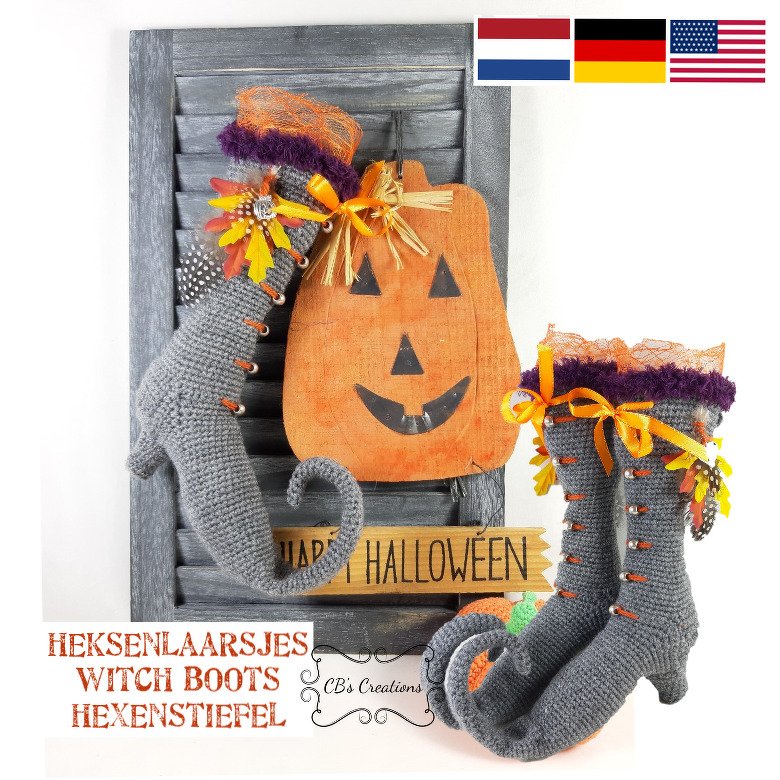 Pair of gray crocheted witch boots with curled toes, orange ribbons and purple trim beside a wooden jack-o'-lantern