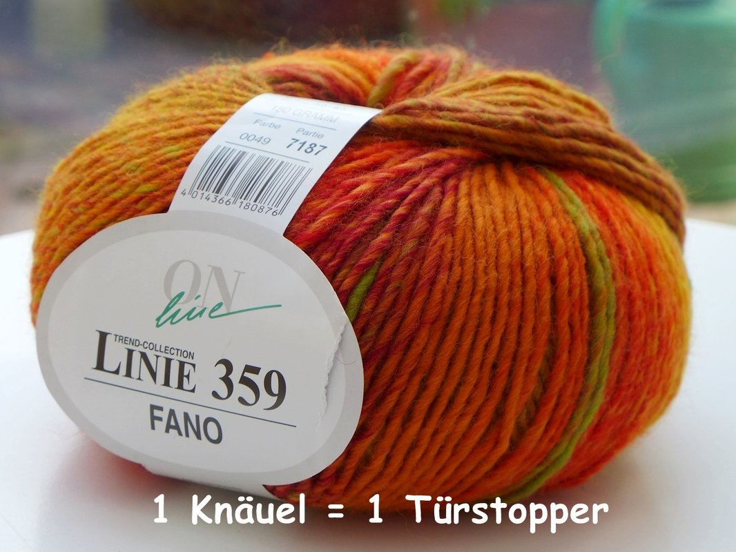 Variegated yarn ball in orange, red, yellow and green with visible label