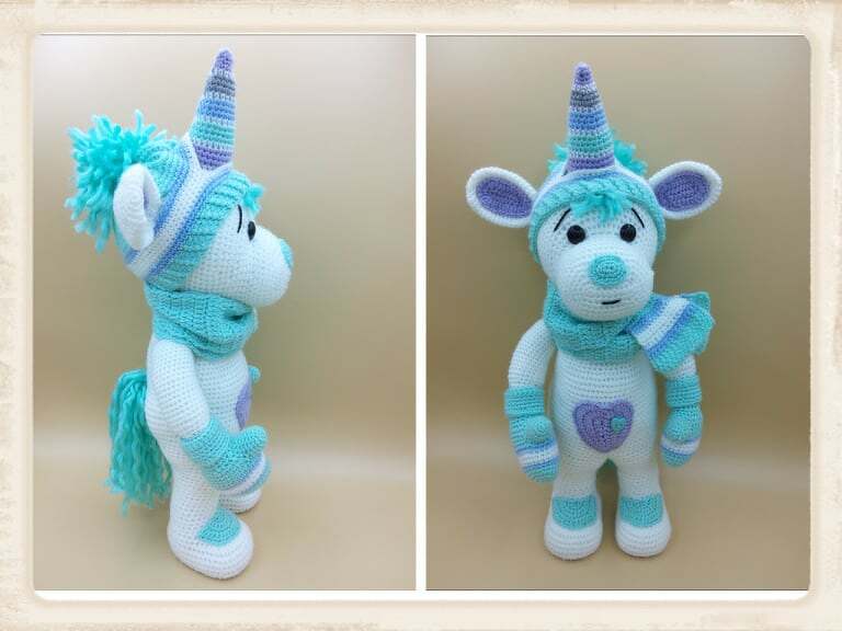 Gehäkeltes Einhorn-Amigurumi in Weiß, Türkis und Lila mit Mütze, Schal und Handschuhen