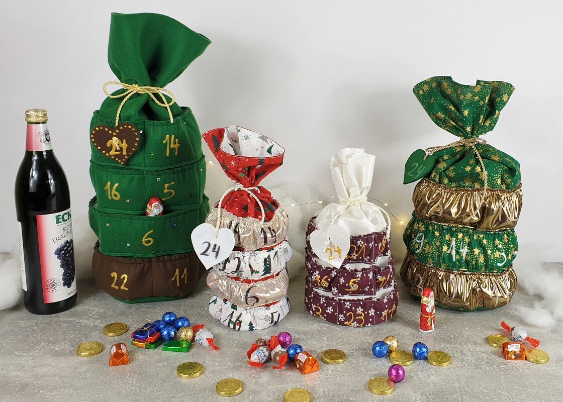 Handgenähte Stoff-Adventskalender in verschiedenen Designs mit nummerierten Taschen